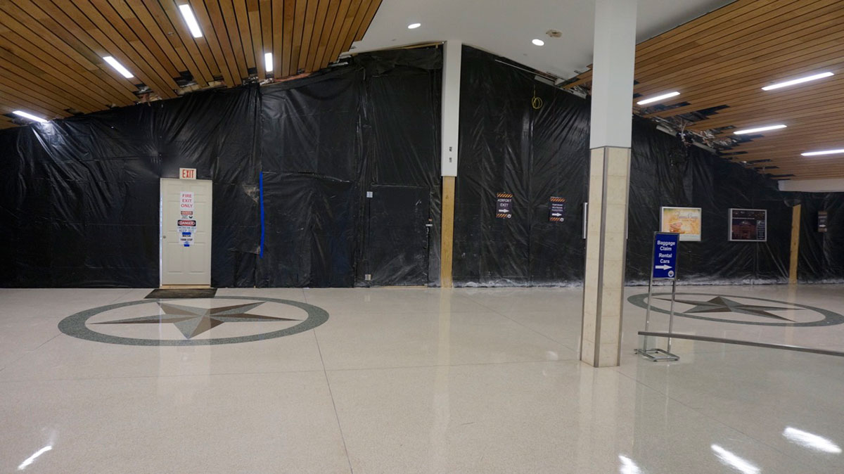 Looking towards the west wall, under construction, inside the terminal building. By Tuesday afternoon, airport staff had cleared out the water. (LIVE! Photo/Joe Hyde) Looking towards the west wall, under construction, inside the terminal building. By Tuesday afternoon, airport staff had cleared out the water. (LIVE! Photo/Joe Hyde)