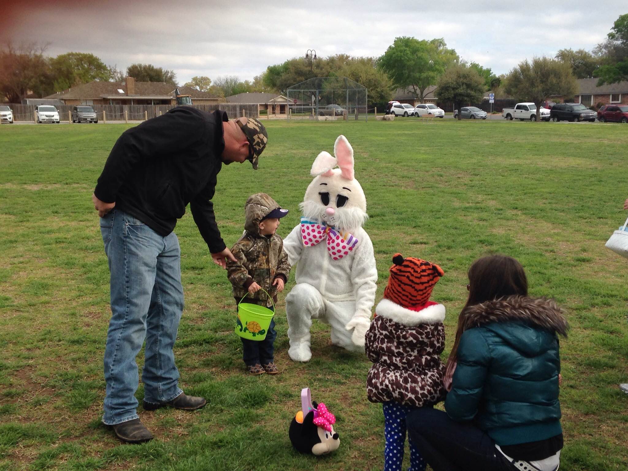 Child takes photo with the Bunny in the Park