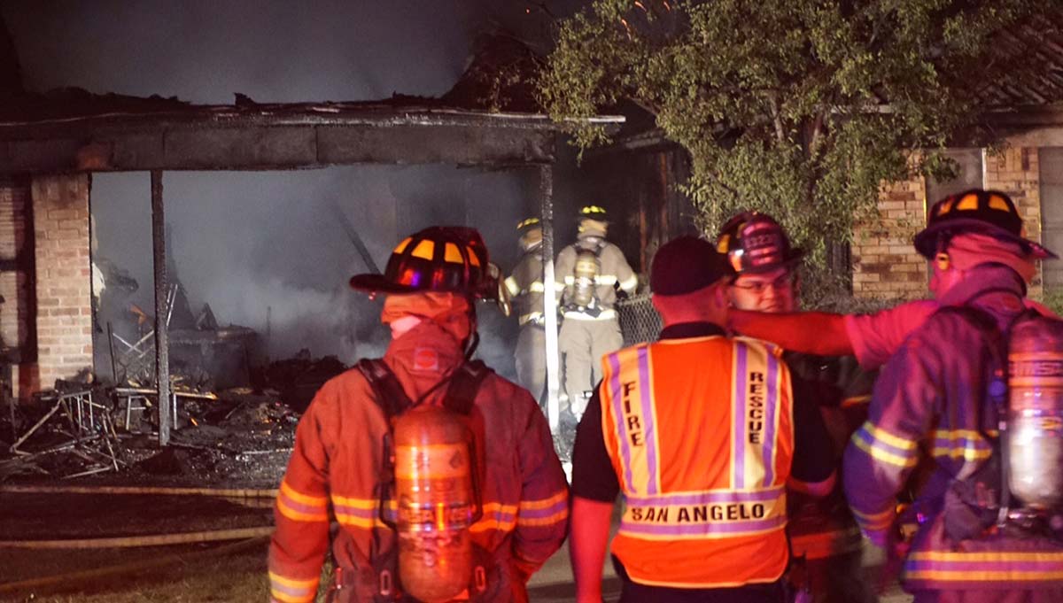 Firefighter battle structure fire at two residences in 1500 block of N. Garfield St. on Jun. 19, 2015. (LIVE! Photo/John Basquez)
