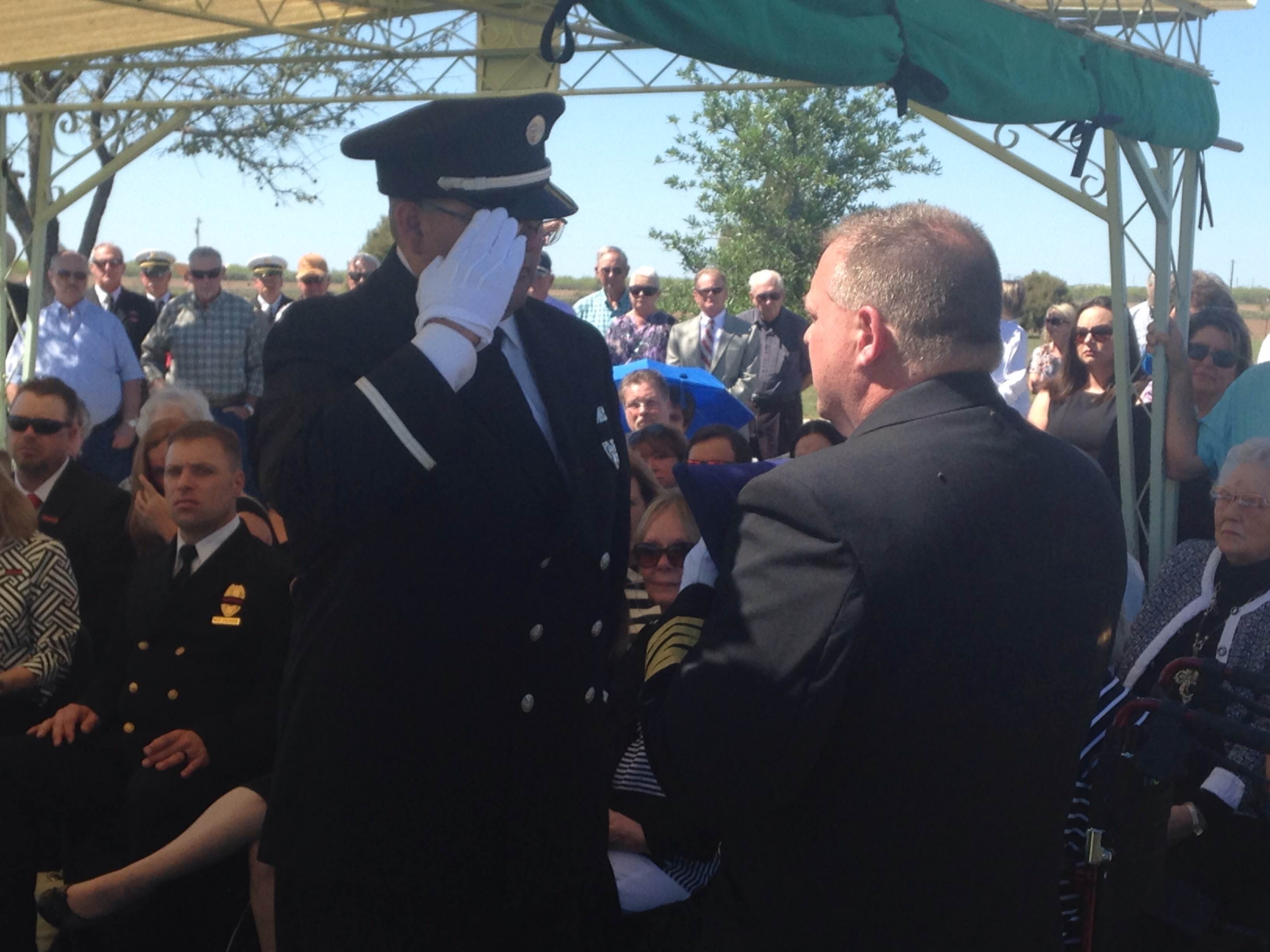 Fire Chief Dunn receives the Texas flag