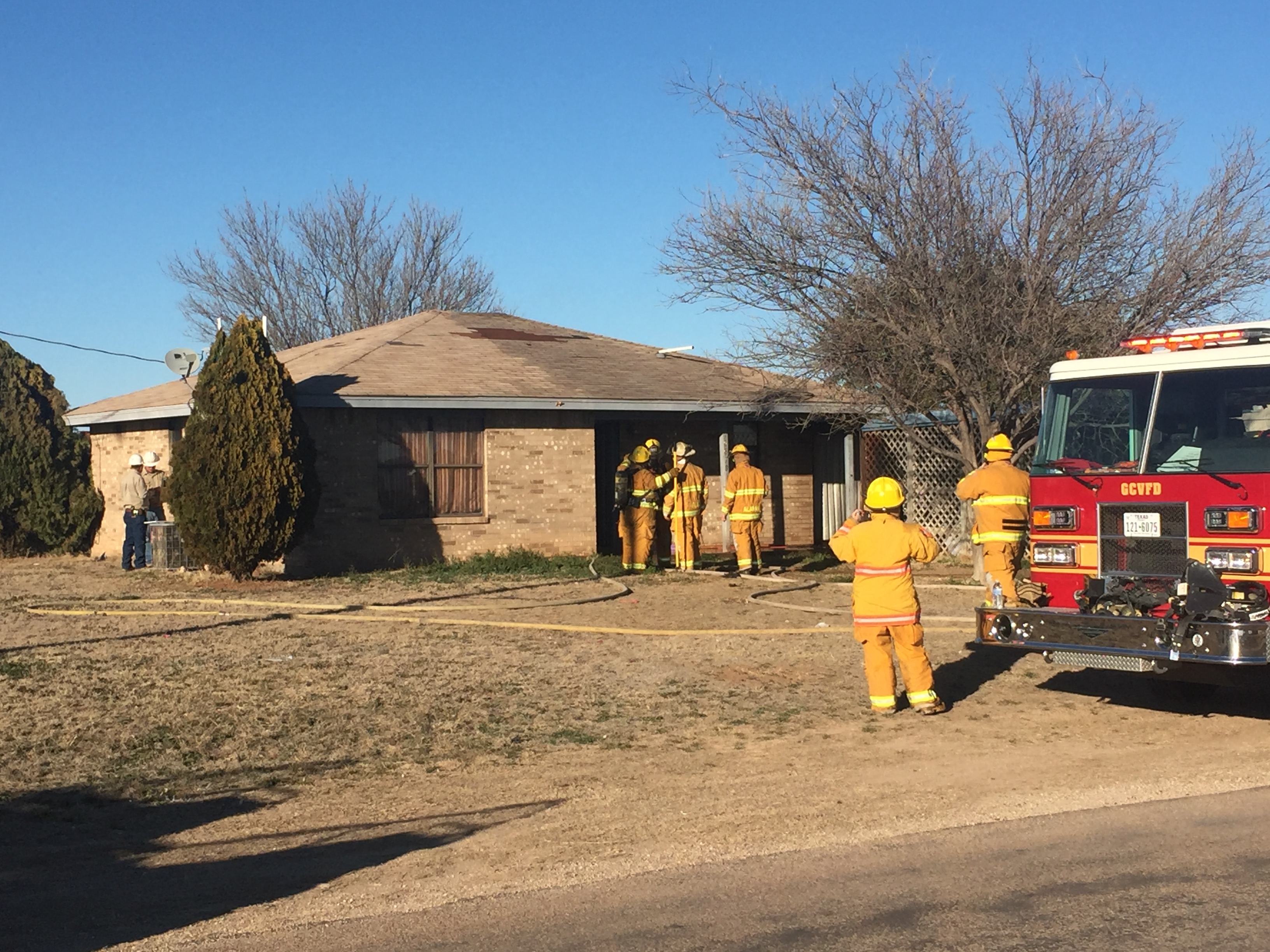 Firefighters battle a blaze in Grape Creek. (LIVE! Photo/Megan Holmquest) Firefighters battle a blaze in Grape Creek. (LIVE! Photo/Megan Holmquest)