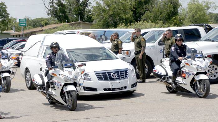 The head of the funeral procession enters the grounds of the Foster Communications Coliseum. (LIVE! Photo/Benjamin Hettick)