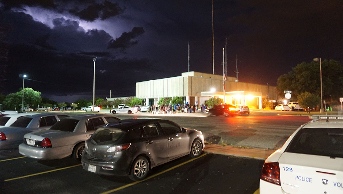 Clouds from an evening thunderstorm approach overhead as the vigil for fallen police officer Korby Kennedy concluded last night. (LIVE! Photo/John Basquez)