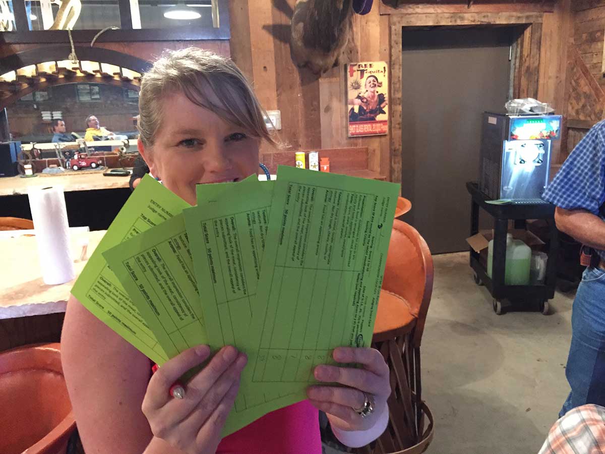 Tara O&amp;#039;Donnell shows the judging cards for the smoked ribs competition. (LIVE! Photo/Joe Hyde)