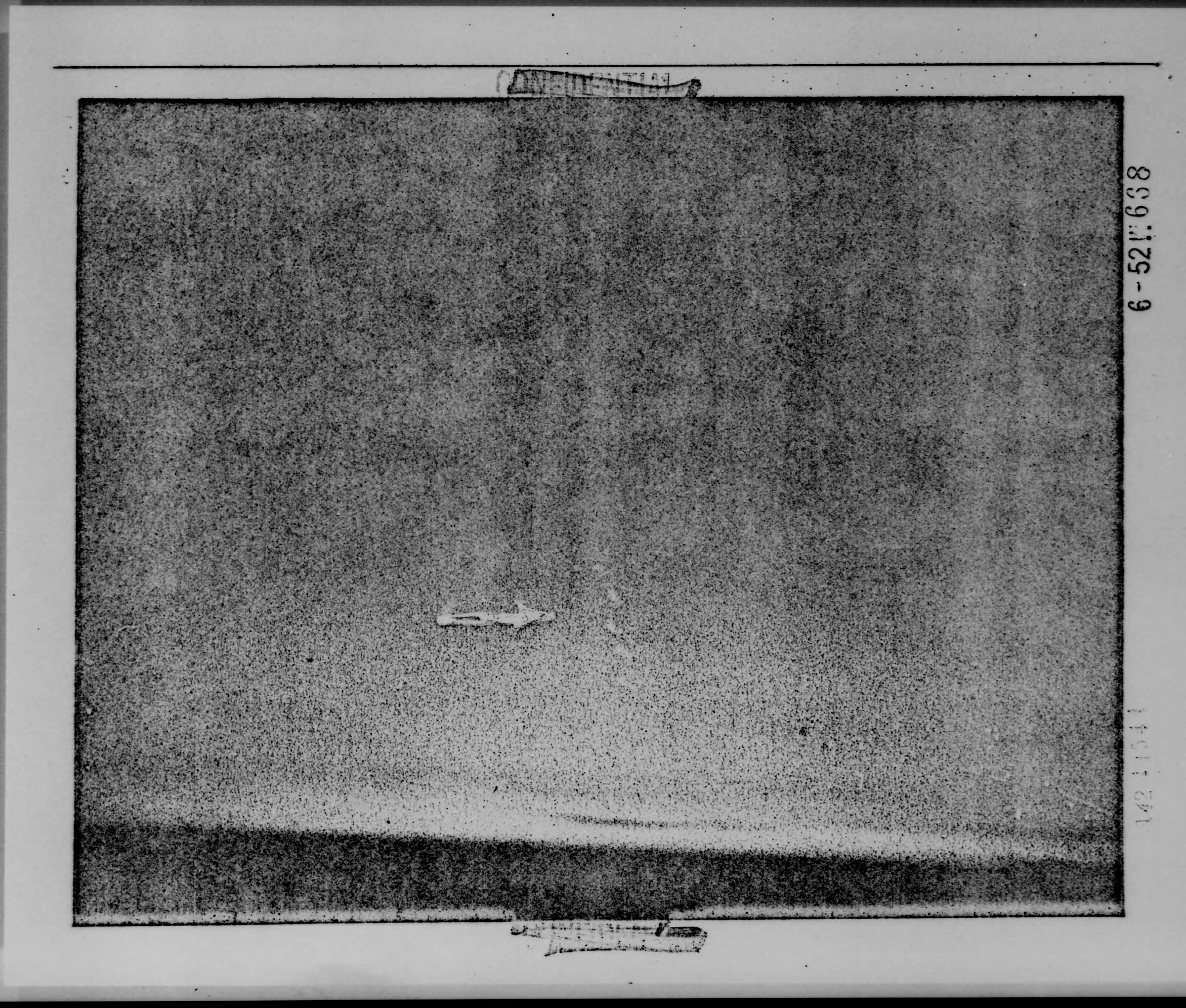 A terrible copy of the photograph contained in the National Archives. In the center, you can see a hand-drawn arrow pointing towards the 7 unidentified objects observed from the RB-36 crew. (National Archives)