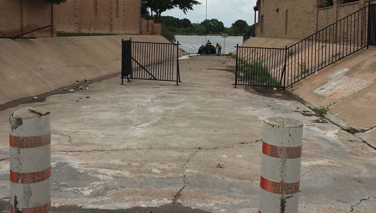 The drainage ditch the PT Cruiser is said to have floated through into the lake. (LIVE! Photo/Megan Holmquest) The drainage ditch the PT Cruiser is said to have floated through into the lake. (LIVE! Photo/Megan Holmquest)