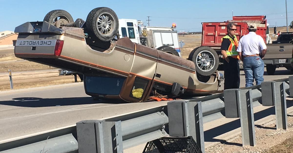 A teenager flips his truck on Houston Harte. (LIVE! Photo/Stephanie Lindgren)