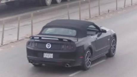 The black 2014 Ford Mustang that the shooter stole from the dead homeowner.
