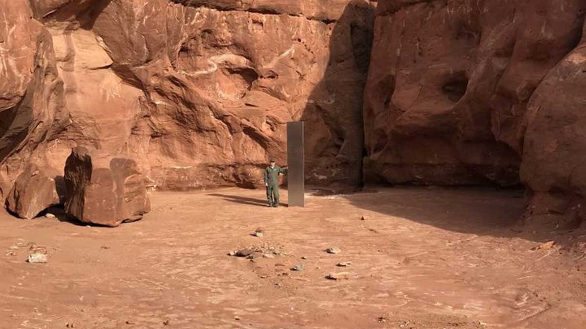 Man next to the monolith Man next to the monolith