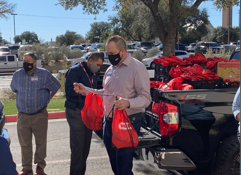 H-E-B's Nick George Giving Donation of 850 Goodie Bags