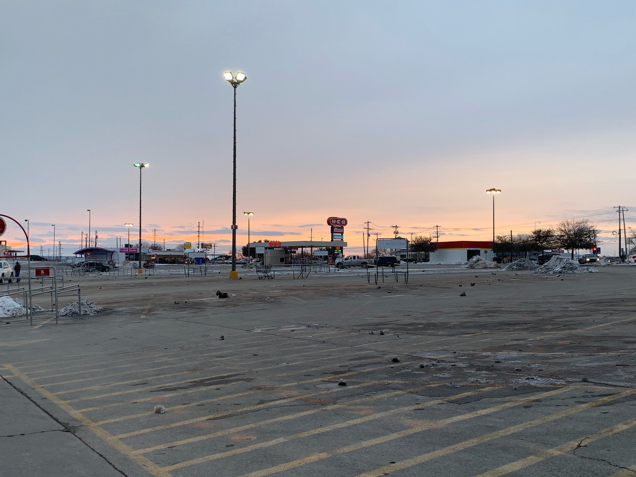 The empty parking lot at HEB at Sherwood Way and Ave. N after it closed at 5 p.m. Thursday