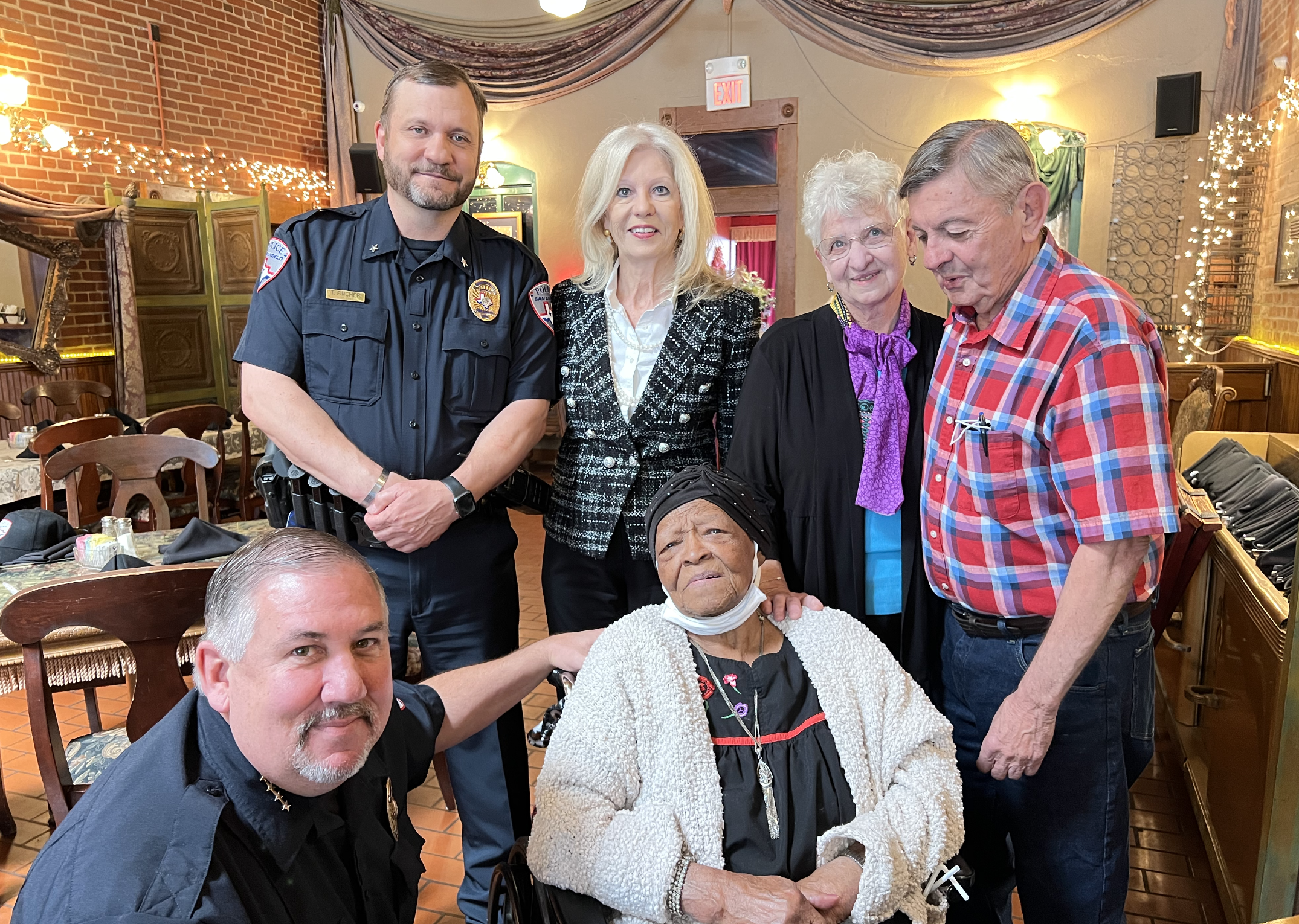 Marie Starks Alongside with Police Chief Frank Carter, Assistant Police Chief Tracy Fincher, Mayor Brenda Gunter, Pator Craig Meyers and his wife Sally.