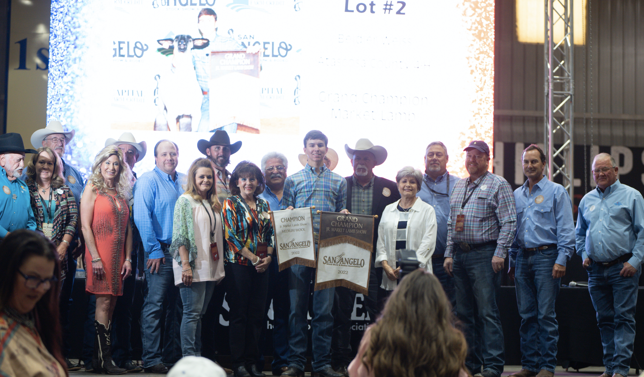 Beider Weiss, Atascosa County 4-H, Grand Champion Lamb Along with Group of Buyers Beider Weiss, Atascosa County 4-H, Grand Champion Lamb Along with Group of Buyers