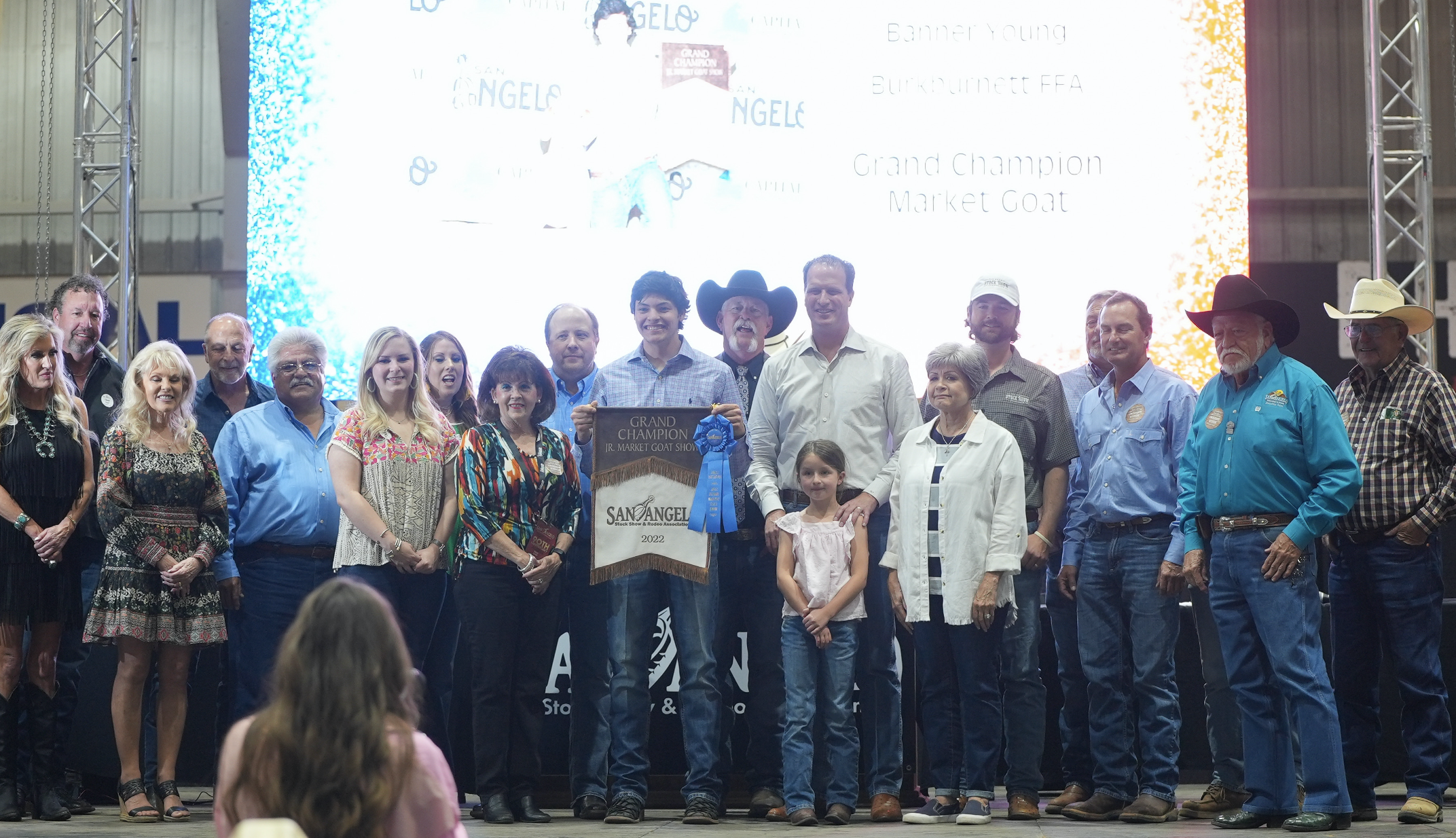 Banner Young, Burkburnett FFA, Grand Champion Goat Along with Group of Buyers Banner Young, Burkburnett FFA, Grand Champion Goat Along with Group of Buyers