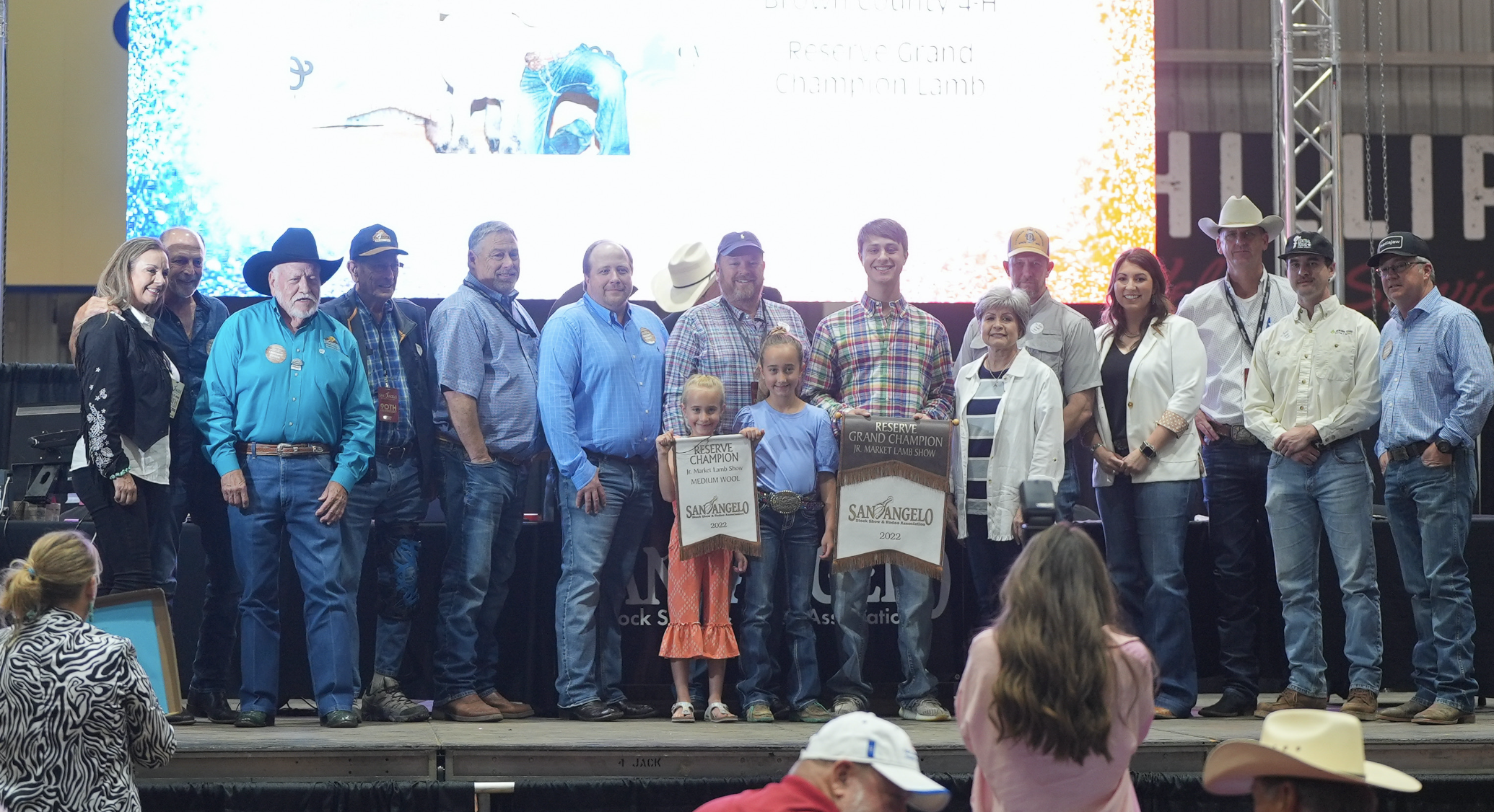 Hayden Schroeder, Brown County 4-H, Reserve Grand Champion Lamb Along with Group of Buyers Hayden Schroeder, Brown County 4-H, Reserve Grand Champion Lamb Along with Group of Buyers