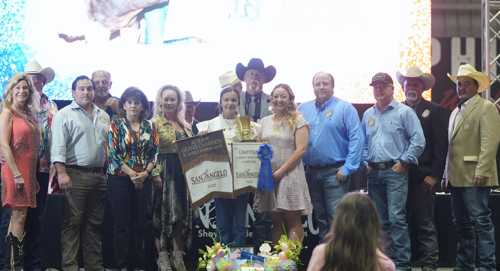 Selah Salmons, Parker County 4-H, Reserve Grand Champion Barrow Along with Group of Buyers Selah Salmons, Parker County 4-H, Reserve Grand Champion Barrow Along with Group of Buyers