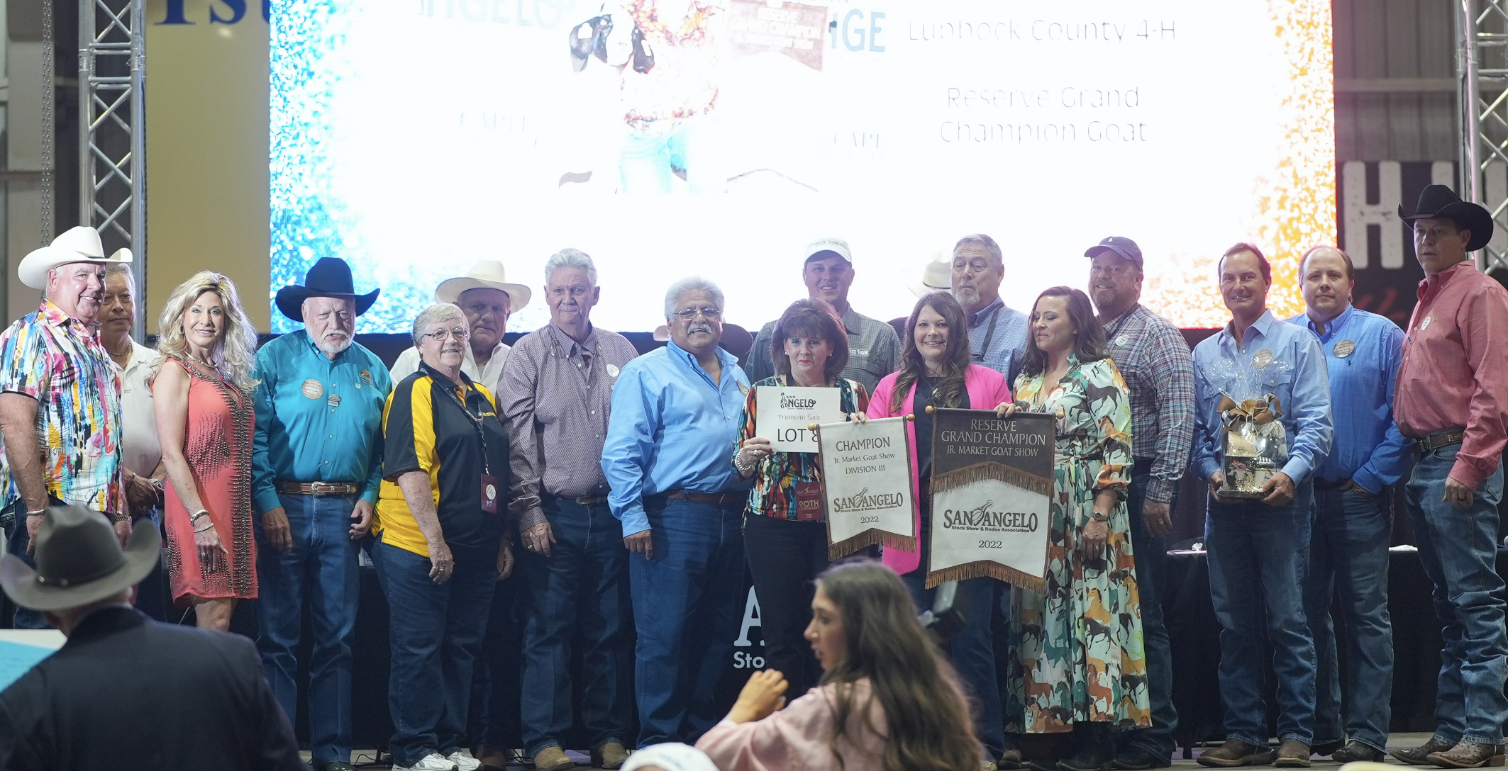 Brynlee Hogg, Lubbock County 4-H, Reserve Grand Champion Goat Along with Group of Buyers Brynlee Hogg, Lubbock County 4-H, Reserve Grand Champion Goat Along with Group of Buyers