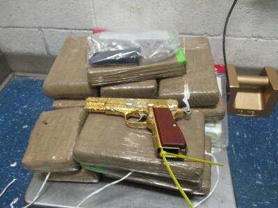34 lbs of Cocaine & a Gold Plated Pistol (Contributed/CBP) 34 lbs of Cocaine & a Gold Plated Pistol (Contributed/CBP)