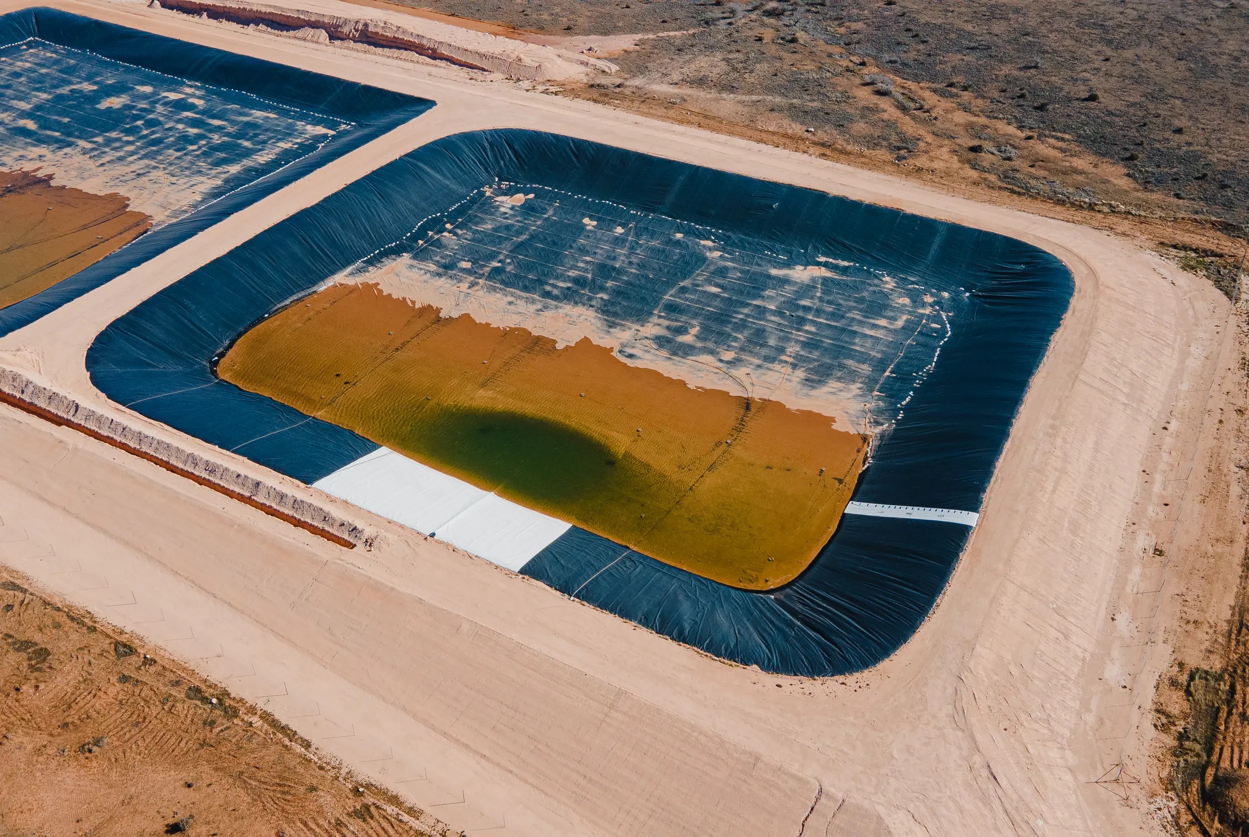 The Texas Railroad Commission approved the construction of produced water ponds to treat and recycle produced water from fracking, next to the Circle 6 Baptist Camp in the Permian Basin. Credit: Julian Mancha for The Texas Tribune/Inside Climate News The Texas Railroad Commission approved the construction of produced water ponds to treat and recycle produced water from fracking, next to the Circle 6 Baptist Camp in the Permian Basin. Credit: Julian Mancha for The Texas Tribune/Inside Climate News