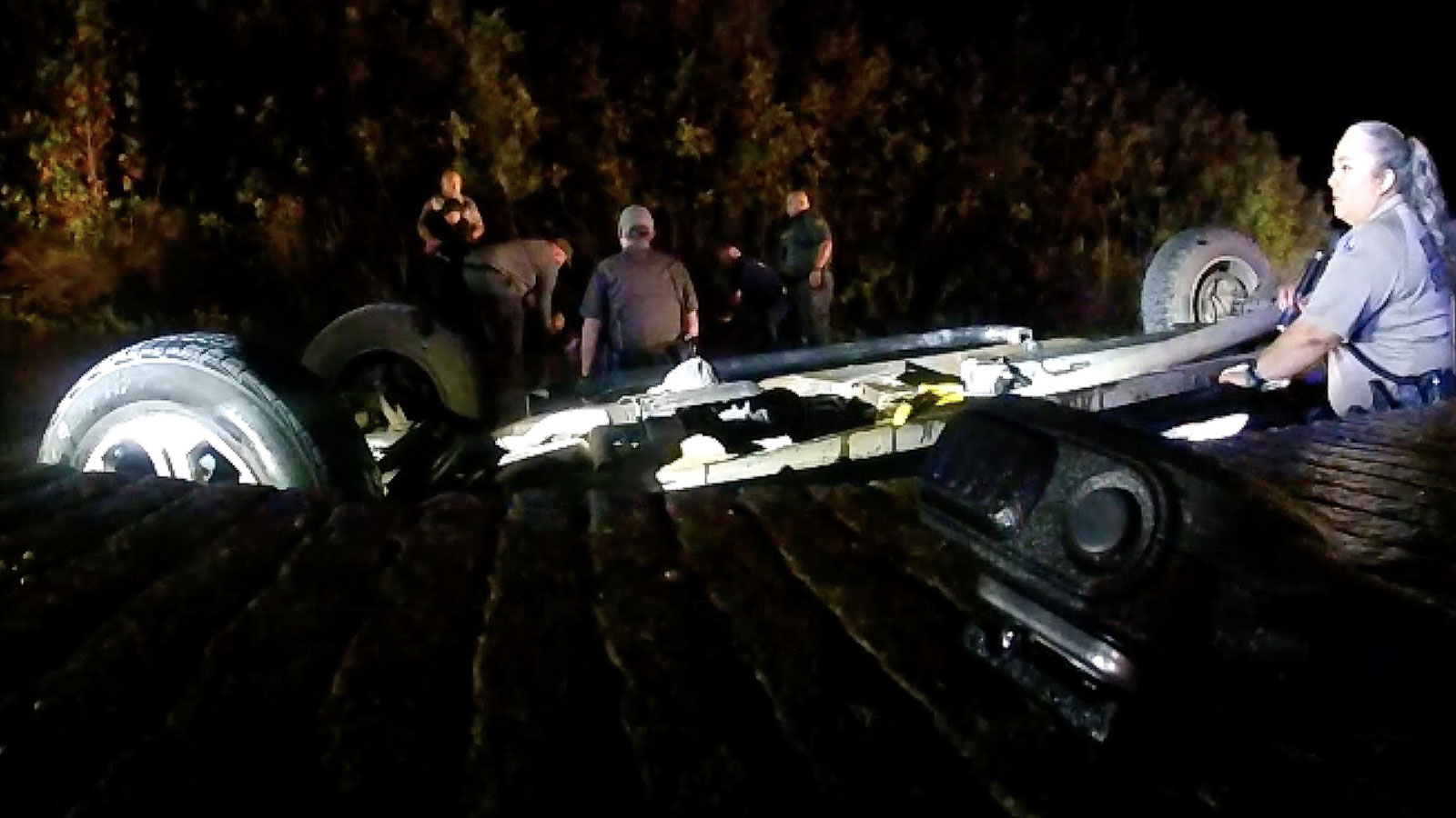 The overturned pickup in the South Llano River with 5 illegal migrants and the human trafficker as first responders attempted to rescue them in Oct. 2022. The overturned pickup in the South Llano River with 5 illegal migrants and the human trafficker as first responders attempted to rescue them in Oct. 2022.