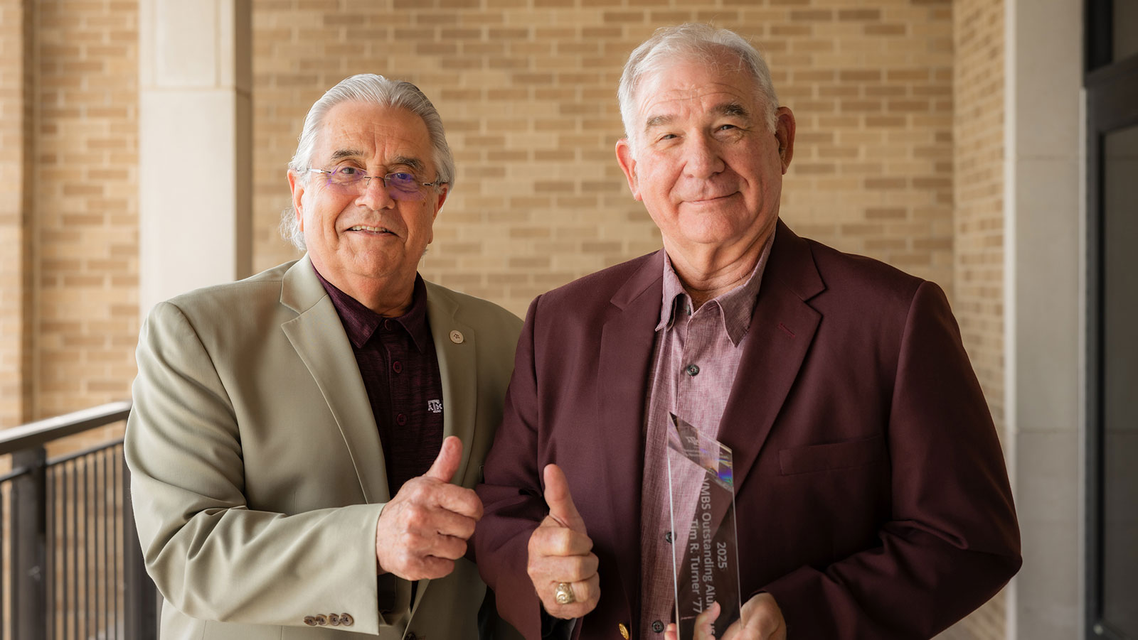 Texas A&M Dean of the College of Veterinary Medicine & Biomedical Sciences (VMBS) Dr. John August (L) with Dr. Tim R. Turner. Texas A&M Dean of the College of Veterinary Medicine & Biomedical Sciences (VMBS) Dr. John August (L) with Dr. Tim R. Turner.