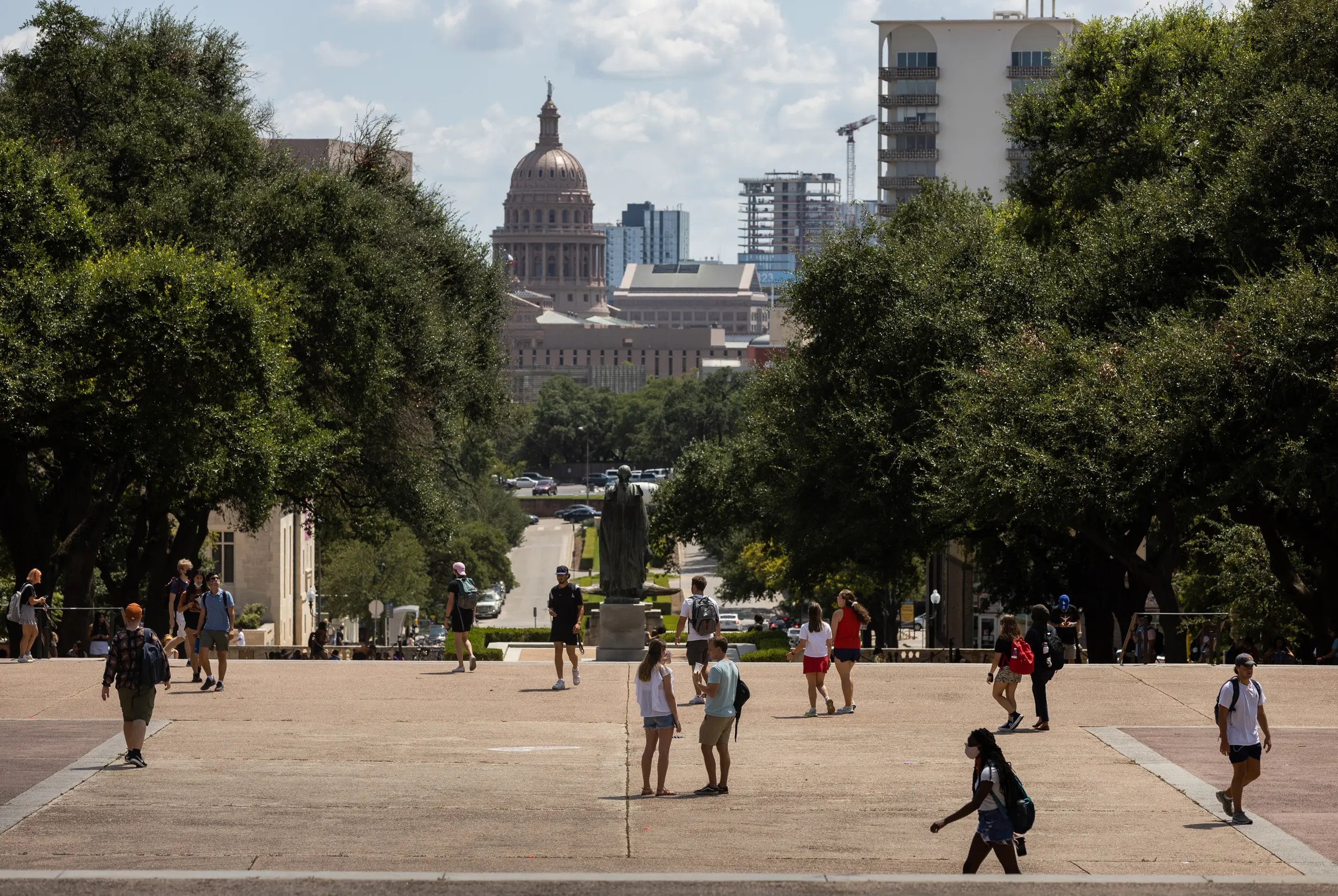 Students walk through campus at the University of Texas at Austin on Aug. 25, 2021. Students walk through campus at the University of Texas at Austin on Aug. 25, 2021.