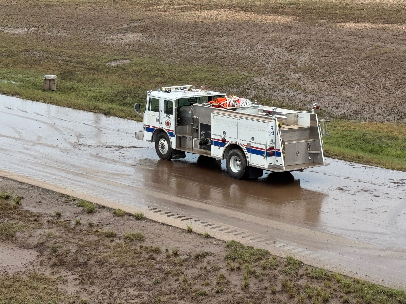 The firetruck after the water drained. It was a former SAFD fire truck sold to a volunteer fire department, Police Chief Travis Griffith guessed. It was not a SAFD truck and you can note that SAFD markings have been removed. The firetruck after the water drained. It was a former SAFD fire truck sold to a volunteer fire department, Police Chief Travis Griffith guessed. It was not a SAFD truck and you can note that SAFD markings have been removed.