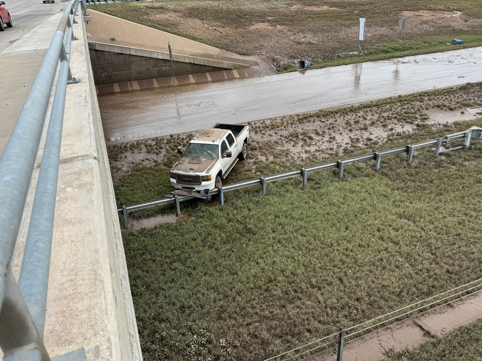 On the east side of the Bell Street overpass were more flooded cars revealed after the flood waters receded. On the east side of the Bell Street overpass were more flooded cars revealed after the flood waters receded.