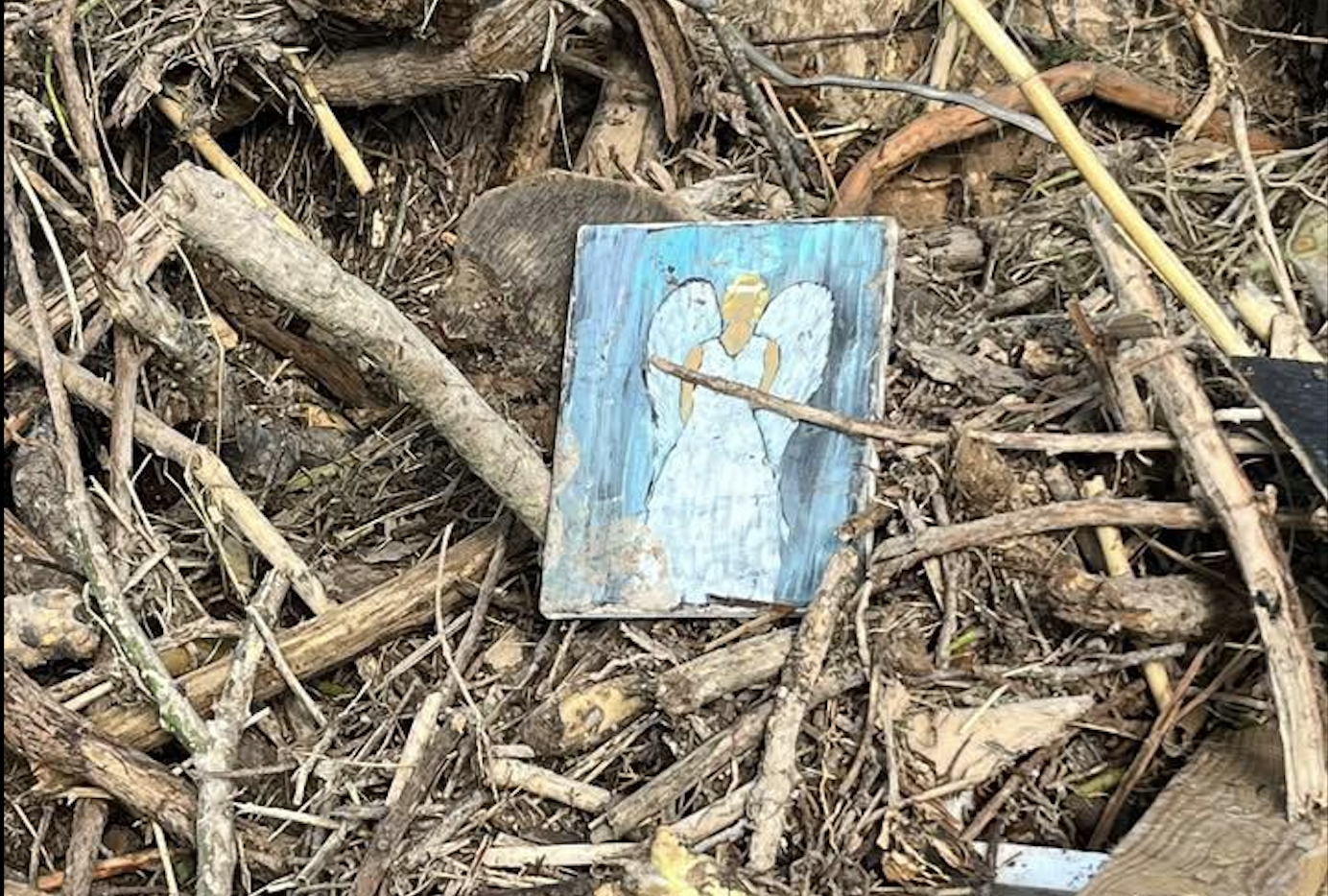A small drawing is shown in the debris from the Guadalupe River flooding. A small drawing is shown in the debris from the Guadalupe River flooding.
