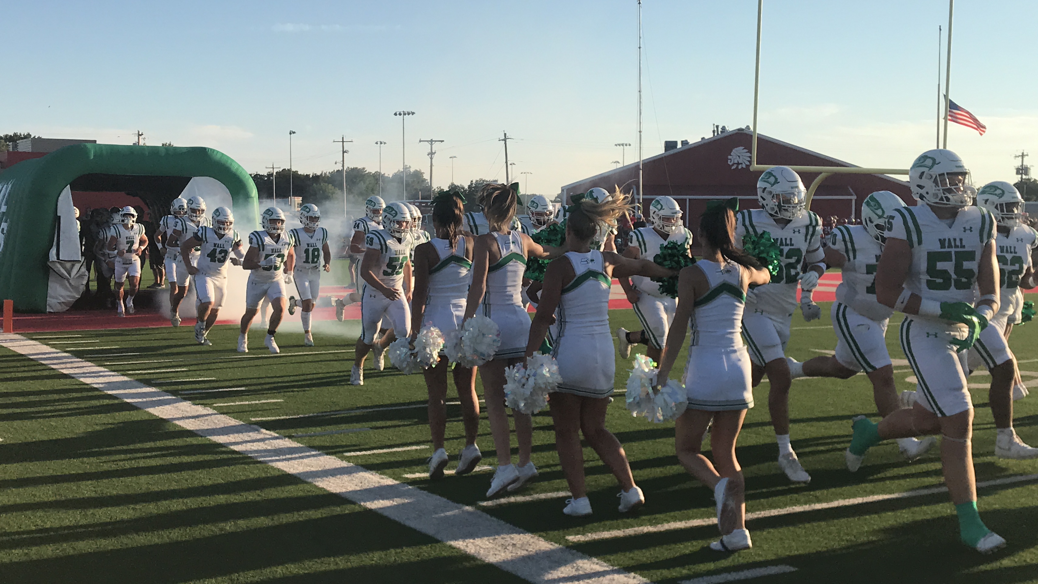 The Wall Hawks run onto the field before their football game with Jim Ned in Tuscola on Friday, Sept. 12, 2025. The Wall Hawks run onto the field before their football game with Jim Ned in Tuscola on Friday, Sept. 12, 2025.