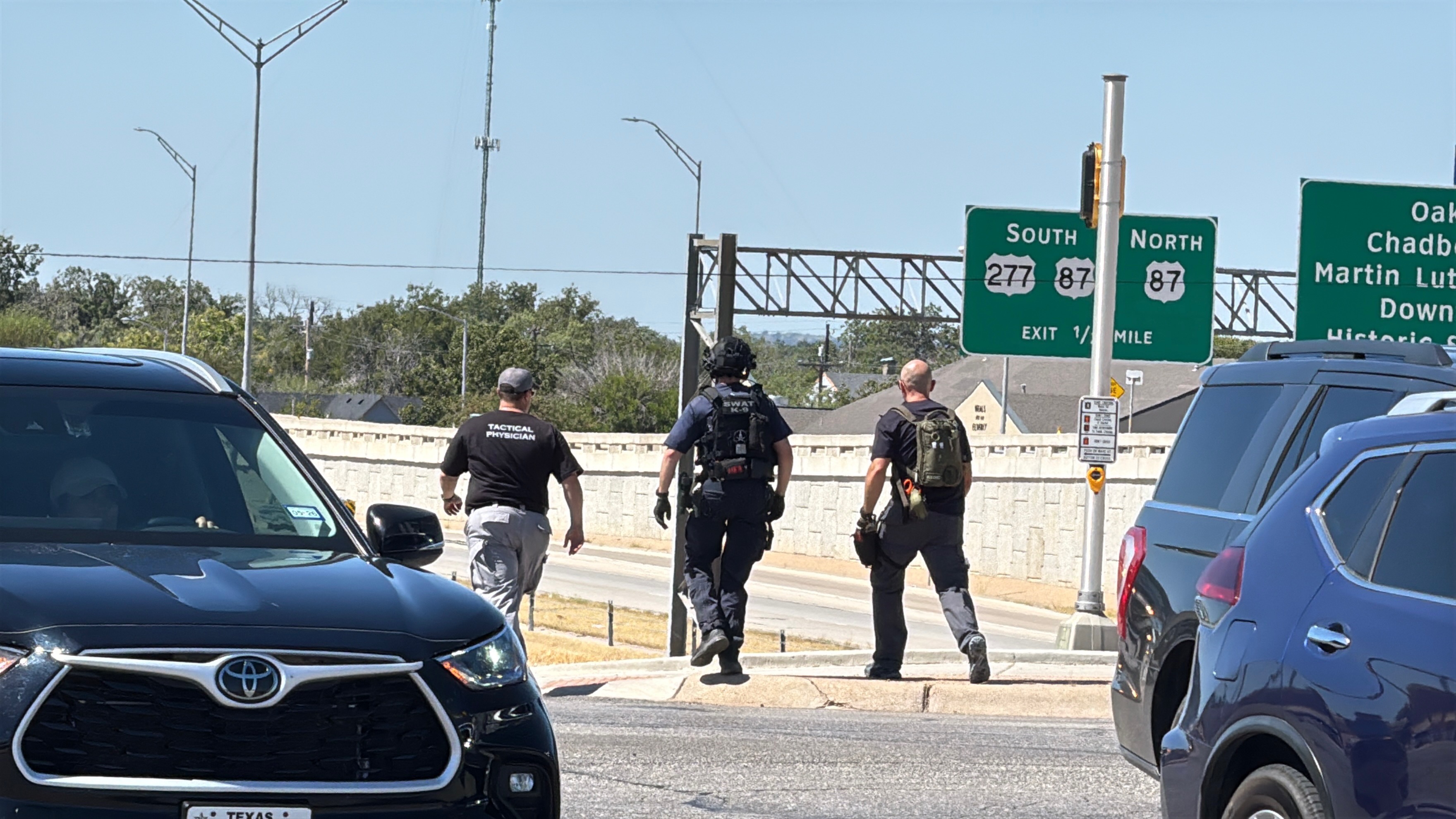 Law enforcement are shown at the scene of a man threatening to jump from the Main Street overpass onto the Houston Harte Expressway. Law enforcement are shown at the scene of a man threatening to jump from the Main Street overpass onto the Houston Harte Expressway.