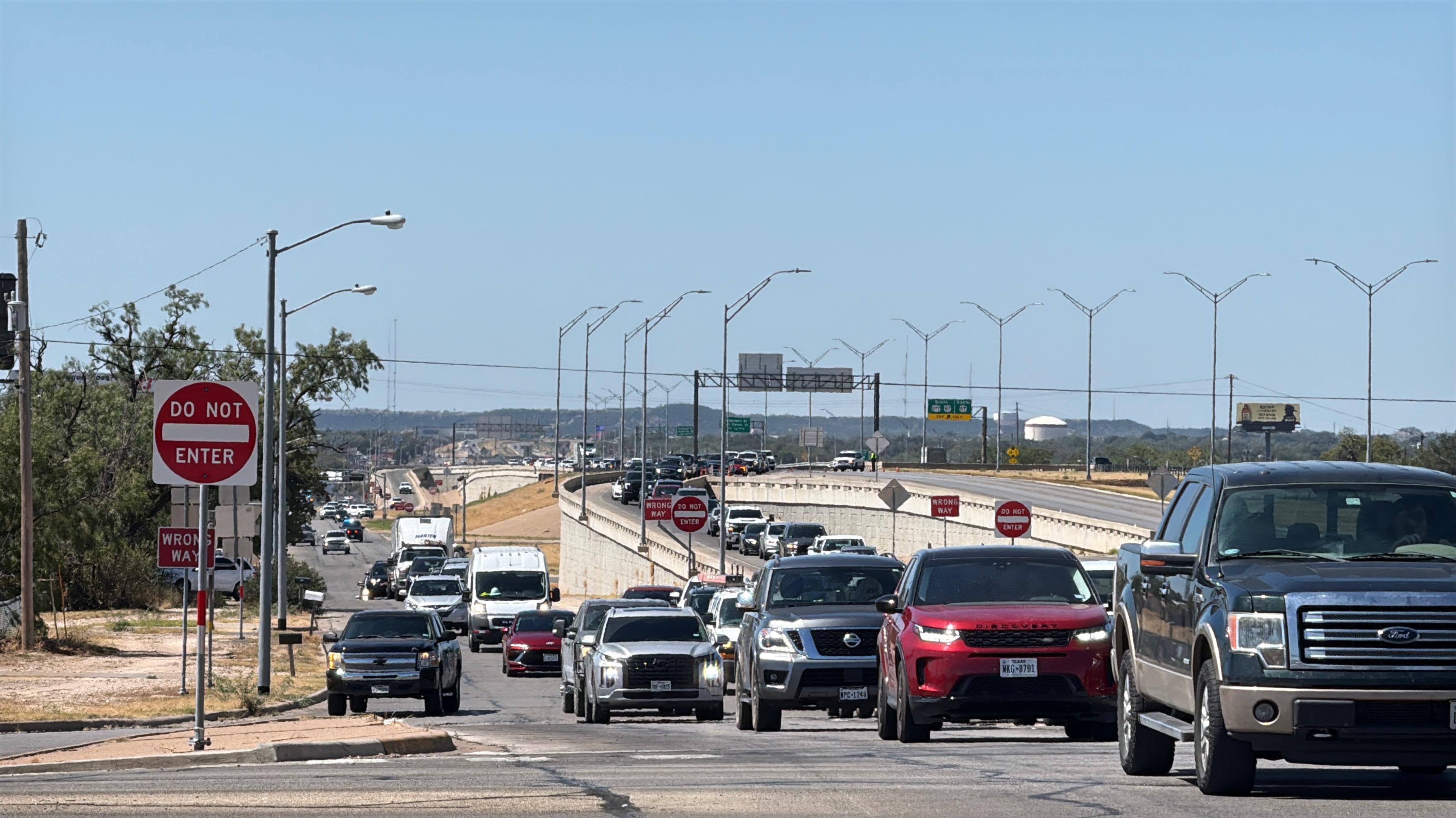 Traffic is shown backed up along the Houston Harte Expressway frontage road after a man threatened to jump from the Main Street overpass on Tuesday, Sept. 23, 2025. Traffic is shown backed up along the Houston Harte Expressway frontage road after a man threatened to jump from the Main Street overpass on Tuesday, Sept. 23, 2025.