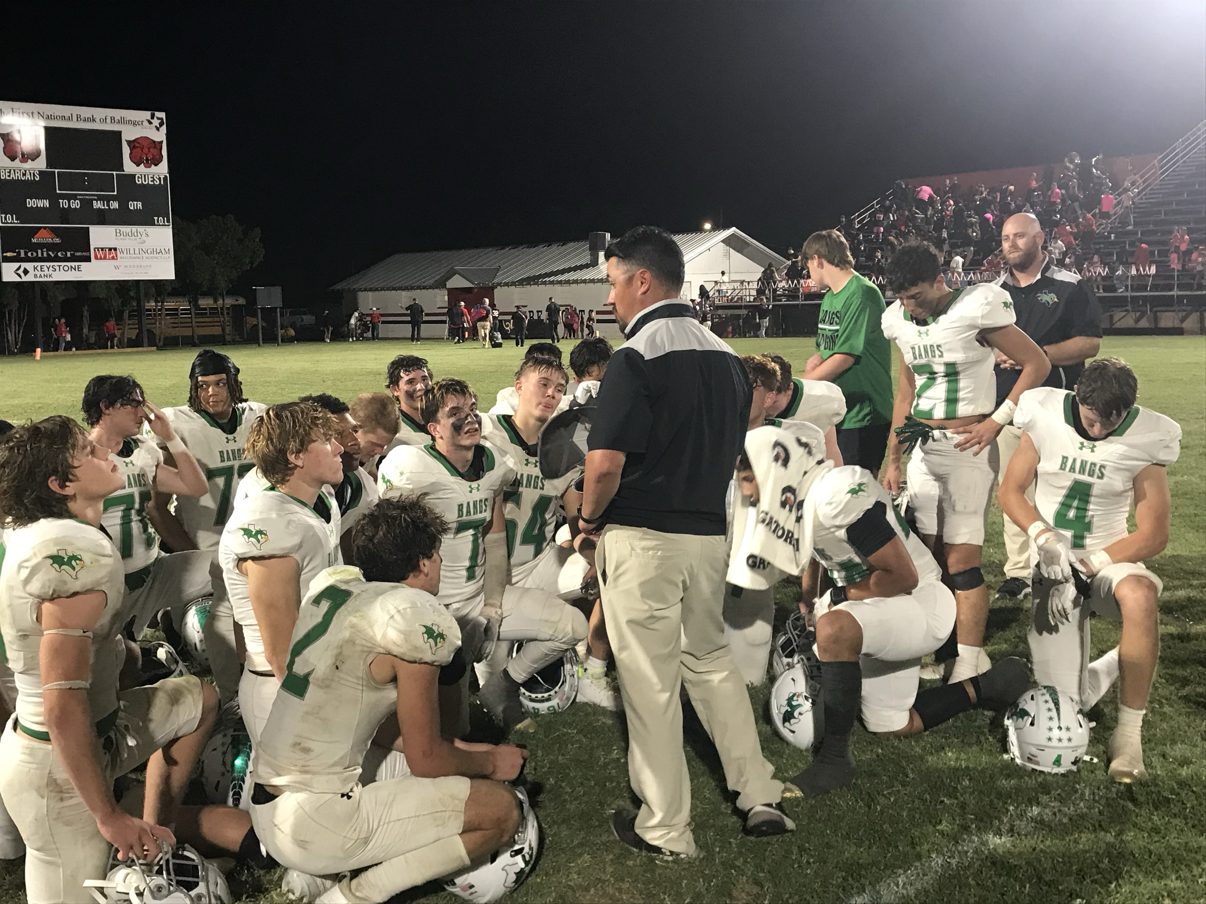 The Bangs football team listens to head coach Colton Buzzard following their 48-0 win over Ballinger on Friday, Oct. 10, 2025. The Bangs football team listens to head coach Colton Buzzard following their 48-0 win over Ballinger on Friday, Oct. 10, 2025.
