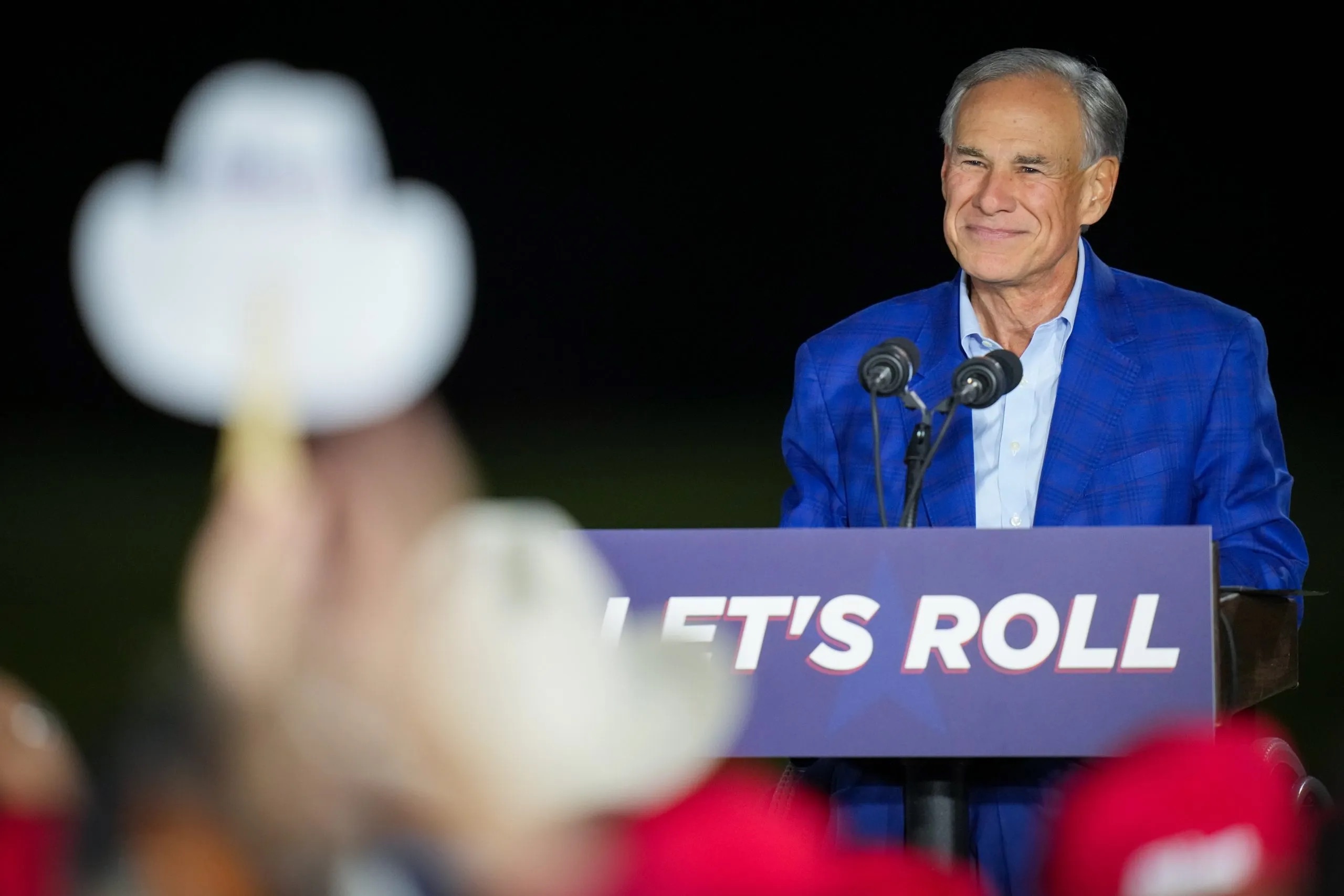Gov. Greg Abbott smiles as people cheered after he announced his intention to run for another term as governor during an event on Sunday, Nov. 9, 2025, at East River 9 in Houston. Jon Shapley for The Texas Tribune