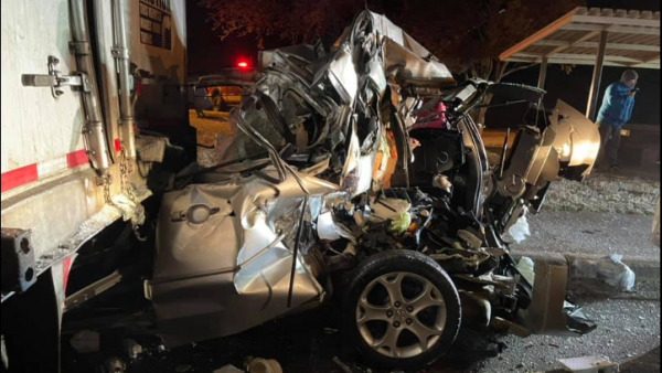 Car Turned to Mangled Metal Mass in Crash with 18-wheelers