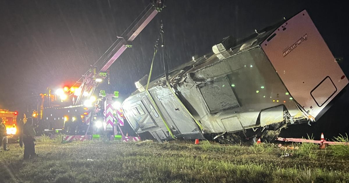 Wind Topples Over Another Truck Towing RV In Wall