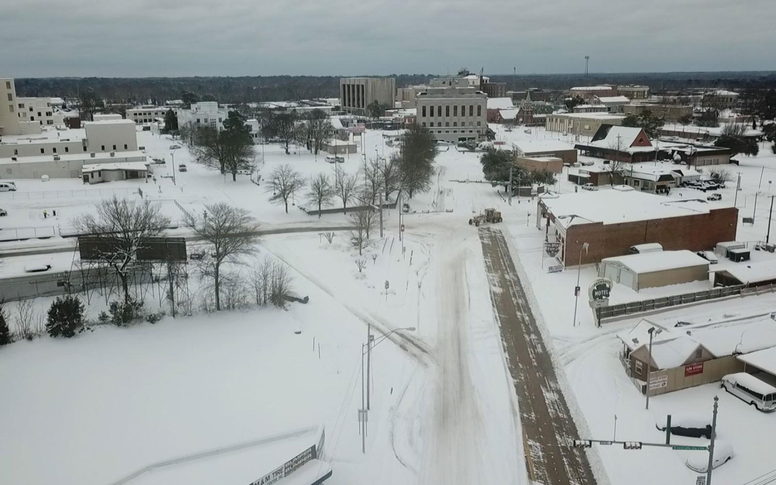 This drone photo was taken 2 days later 2 miles up State Line from where Peek filmed the infamous Feb. 16 video. The Arkansas road-grader repurposed as a snow plow was just arriving. On this section of the road, Arkansas was late plowing.