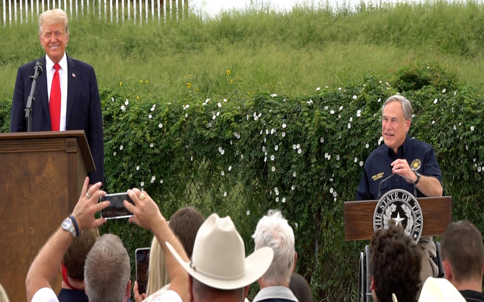 Former President Donald Trump and Texas Governor Greg Abbott at the unfinished border wall in Pharr, Texas.
