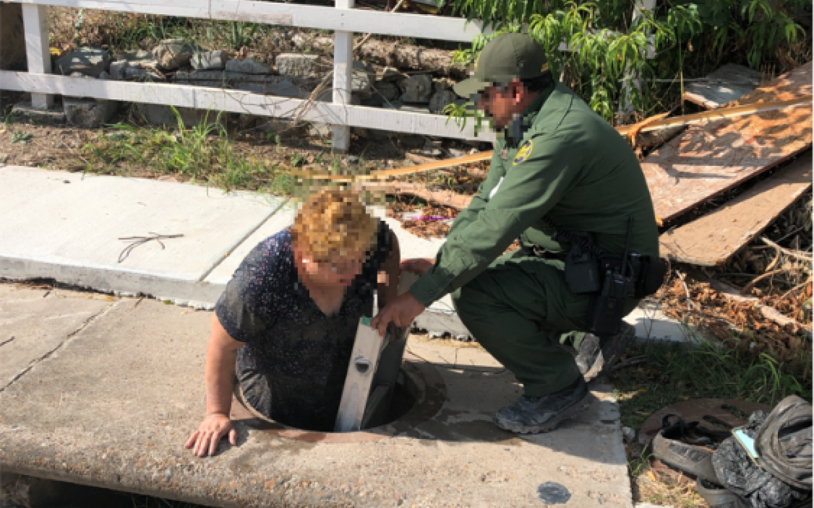 CBP Agent Helps Migrant Out of Sewer (Contributed/CBP)