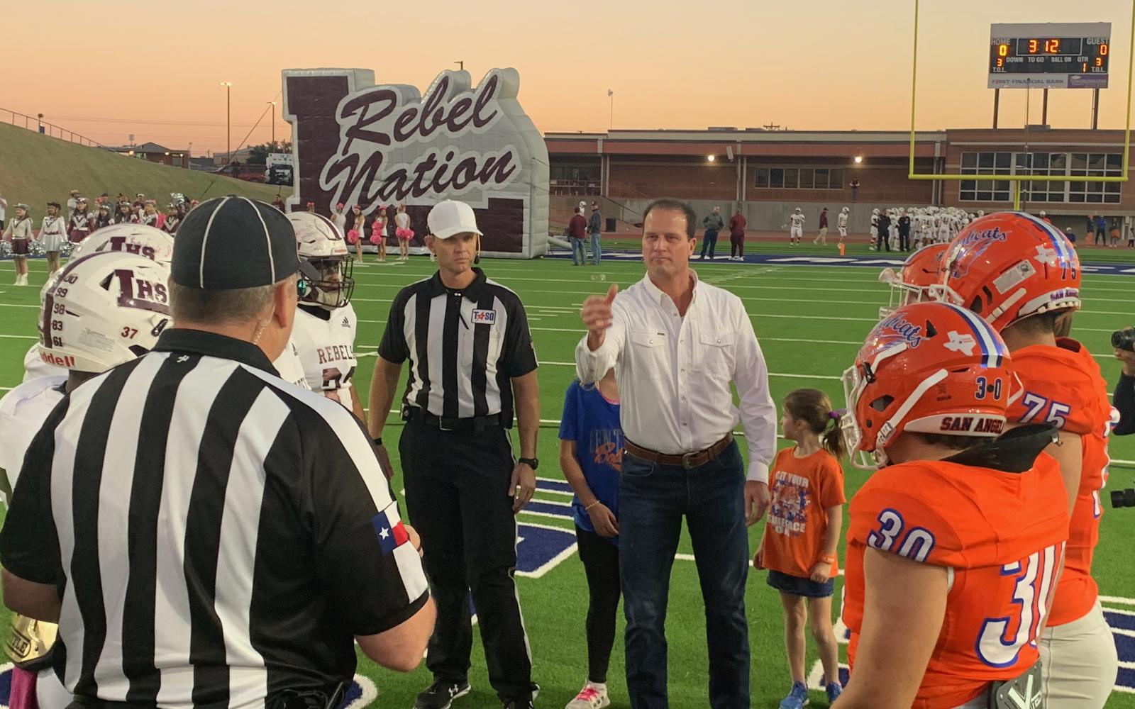 Congressman August Pfluger conducts the coin toss at the San Angelo Central vs. Midland Legacy Rebels on Oct. 29, 2021