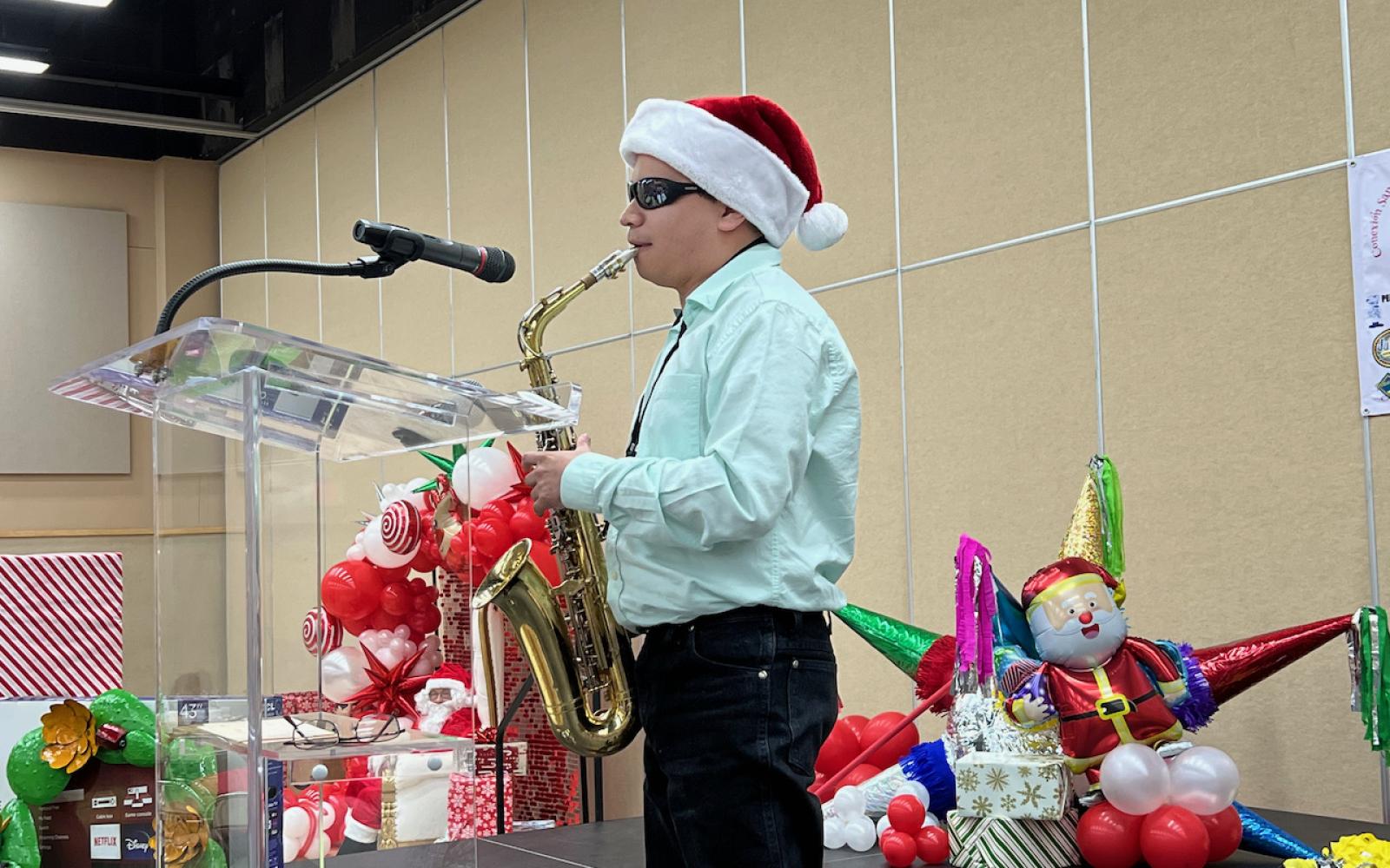 Romi Saldana who plays the saxophone. Romi has been blind all of his life.