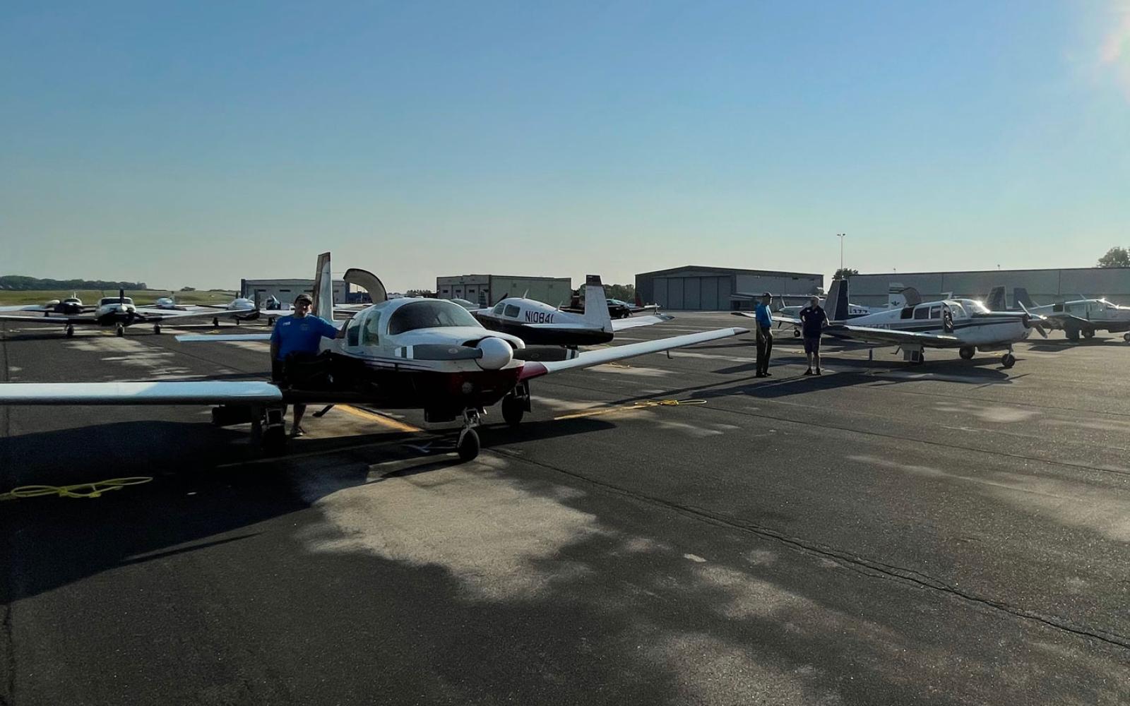 The Mooney Caravan assembles at the Madison, Wisconsin airport just before making the mass formation flight to the EAA AirVenture at Oshkosh, Wisconsin in 2021