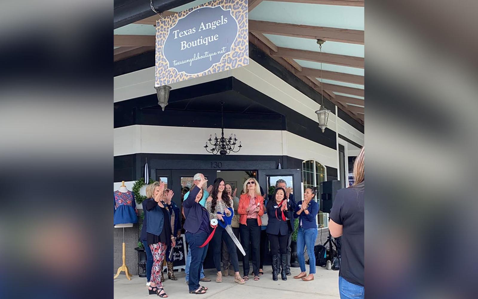 In happier times, Evan Berryhill hosts the grand opening of her Texas Angels Boutique, 113 E Concho Ave Suite 130.