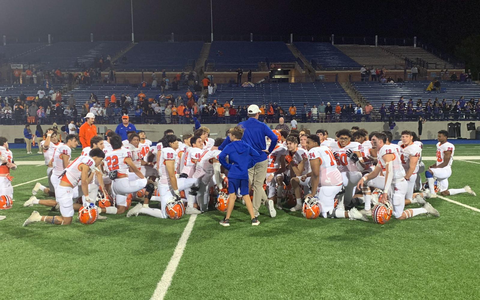 Bobcats Head Coach Kevin Crane congratulates team after grueling 28-25 win over Midland on Oct 7, 2022