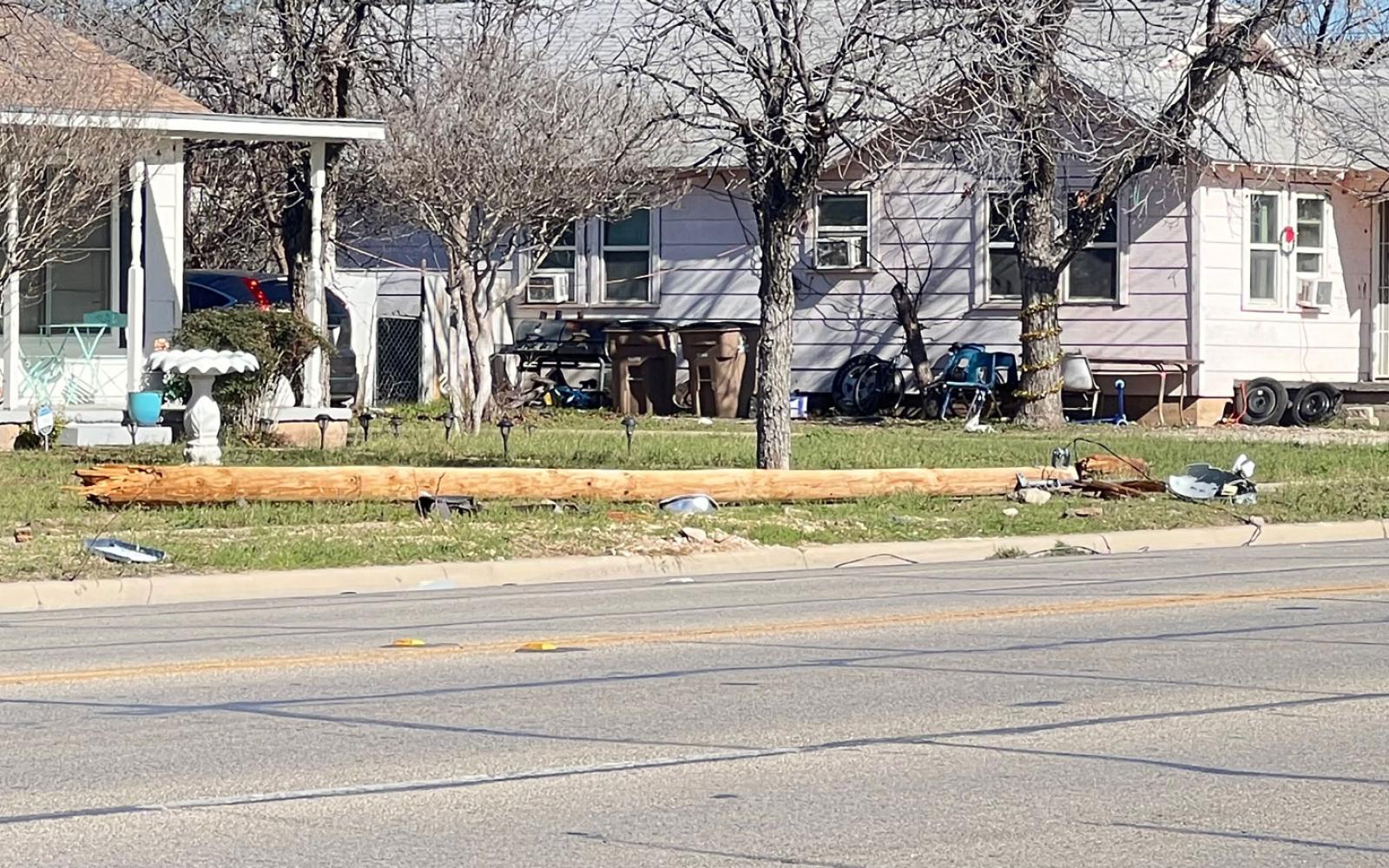 A single vehicle crash near the intersection of N. Irving St. and W. 19th St. has taken out two telephone poles on Dec. 15, 2022.