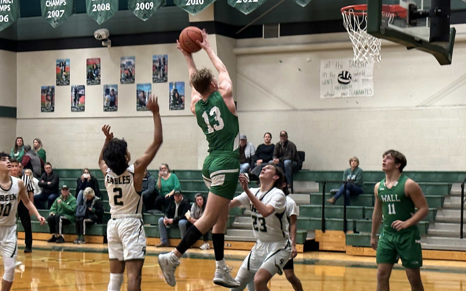 Wall's Everson Armstrong rebounds the Basketball.