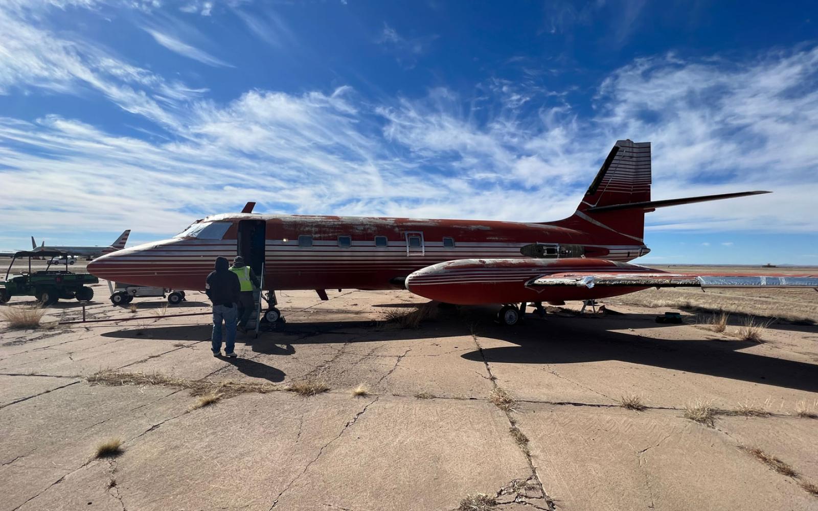 Saturday, Feb. 11, 2023, crews were working towards removing the wings to load the plane in parts on two trucks to transport it to Florida.