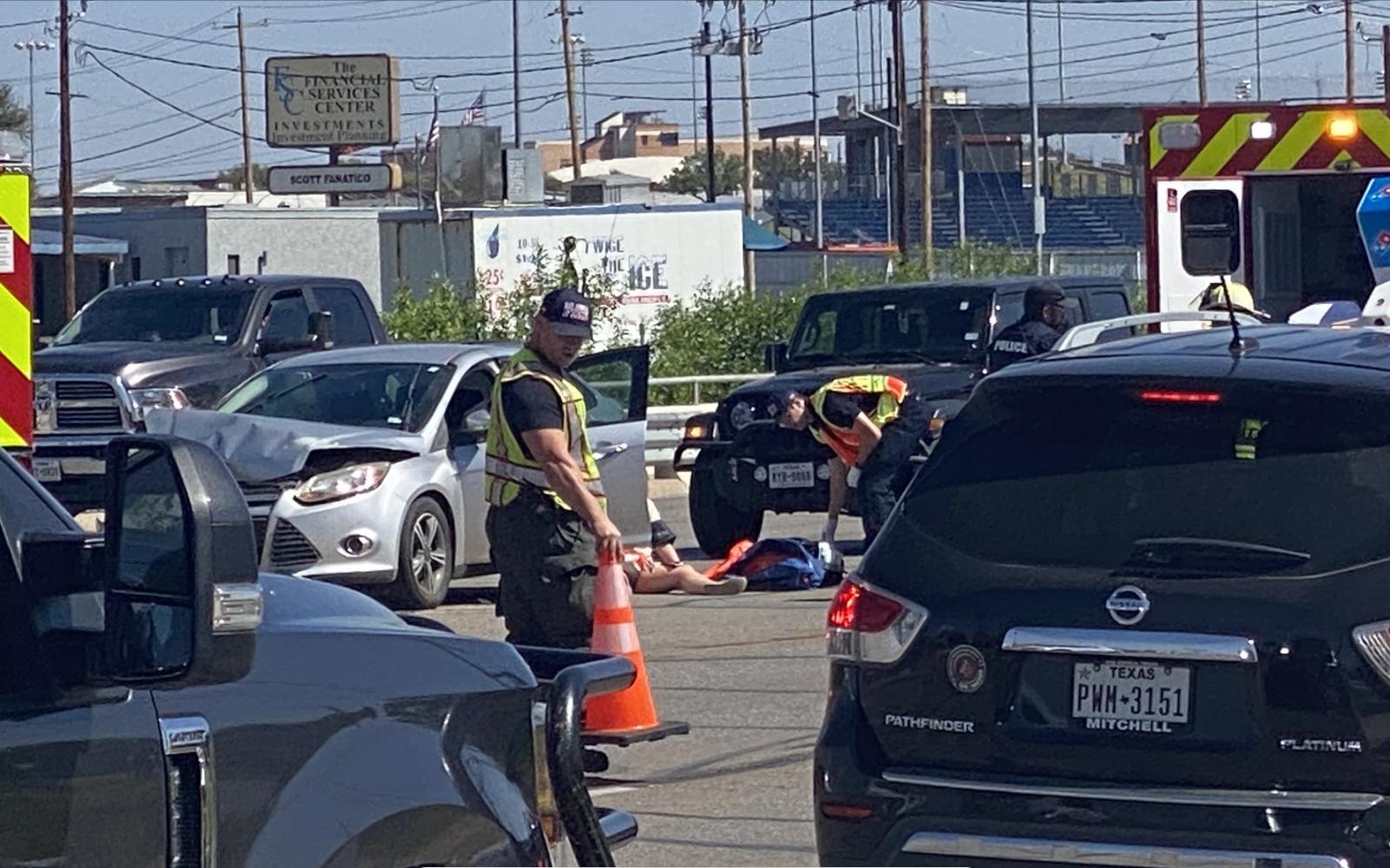 Injured Person on the Ground after Knickerbocker Rd. Crash 3.23 (LIVE! Photo/James Bouligny)