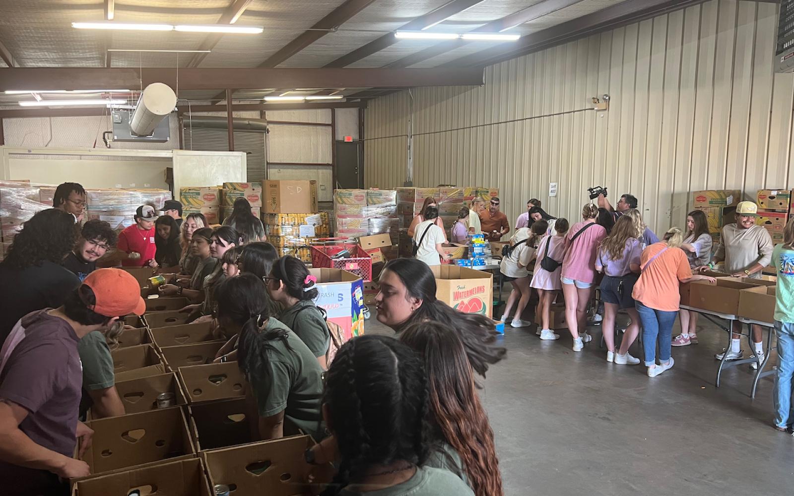 Three sororities and four fraternities sent volunteers from all classes — freshmen through seniors — to help the food bank for three hours on a Thursday evening.