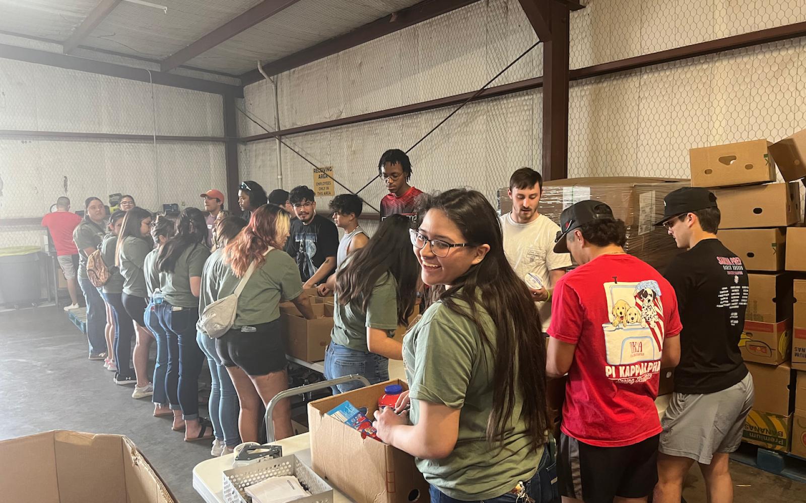 Three sororities and four fraternities sent volunteers from all classes — freshmen through seniors — to help the food bank for three hours on a Thursday evening.